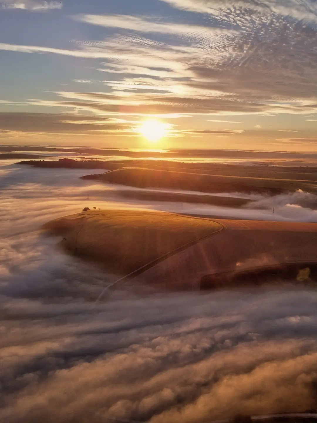 Sunrise over the South Downs from Truleigh Hill, with a sea of cloud below